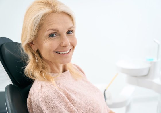 Woman smiling in the dental chair