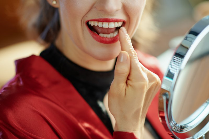 Patient smiling with their dental implants